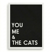 White-framed ‘You Me & The Cats’ typography wall print on a black background