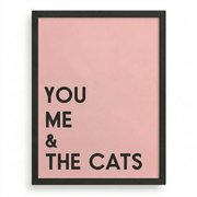 Black-framed ‘You Me & The Cats’ typography wall print on a pink background